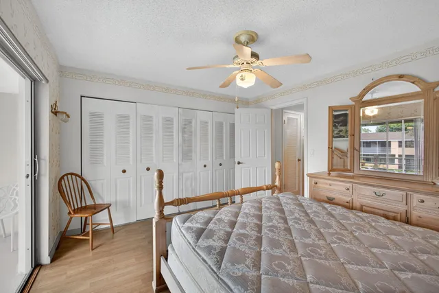 a view of a livingroom with wooden floor and workspace
