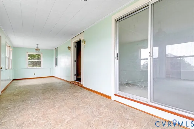 a view of an empty room and window