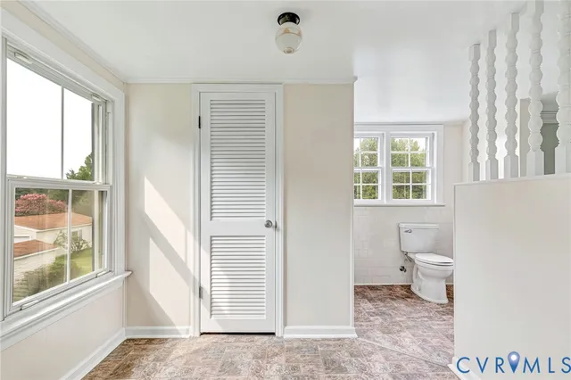 a view of a bathroom with a toilet