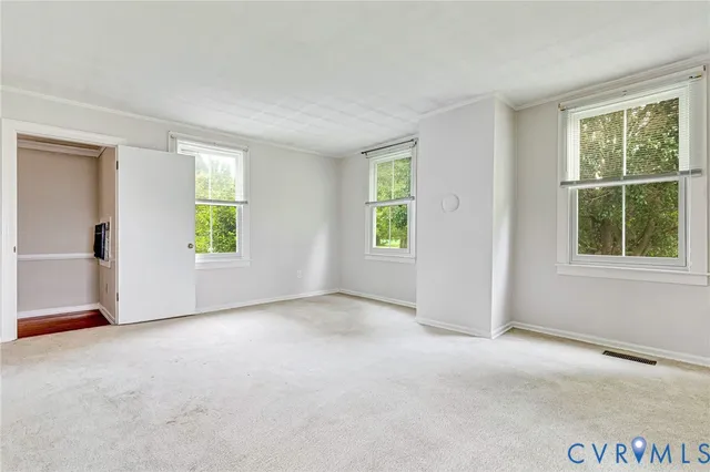 an empty room with windows