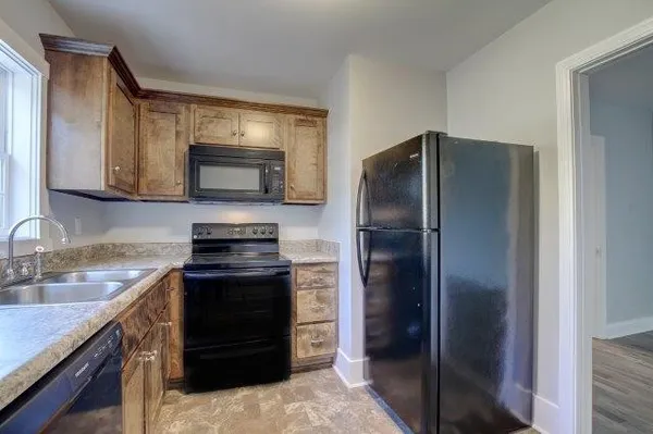 a view of a room with wooden walls