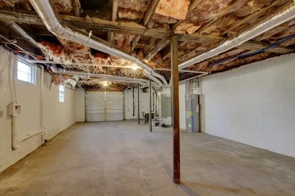 a view of staircase with white walls and a window