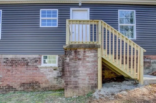 a front view of a house with iron fence
