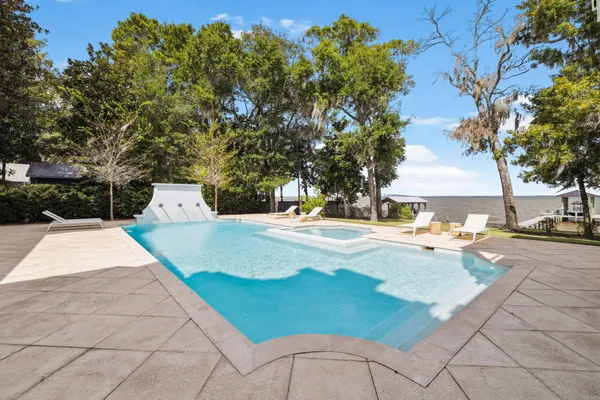 a view of a swimming pool with a patio