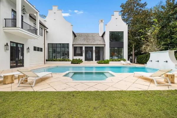a view of a house with a yard and plants