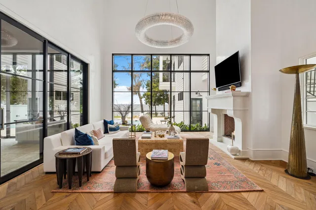 a living room with fireplace furniture and a flat screen tv