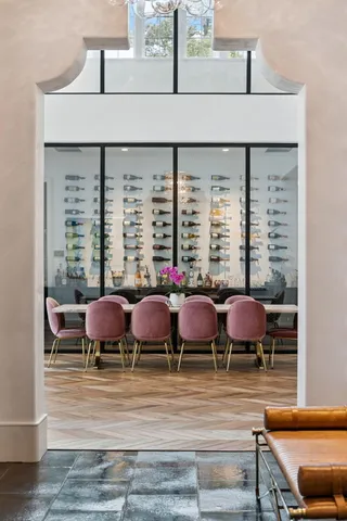 a group of chairs and table on the wooden floor