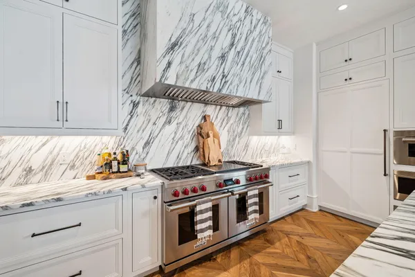 a kitchen with stainless steel appliances a stove and a refrigerator