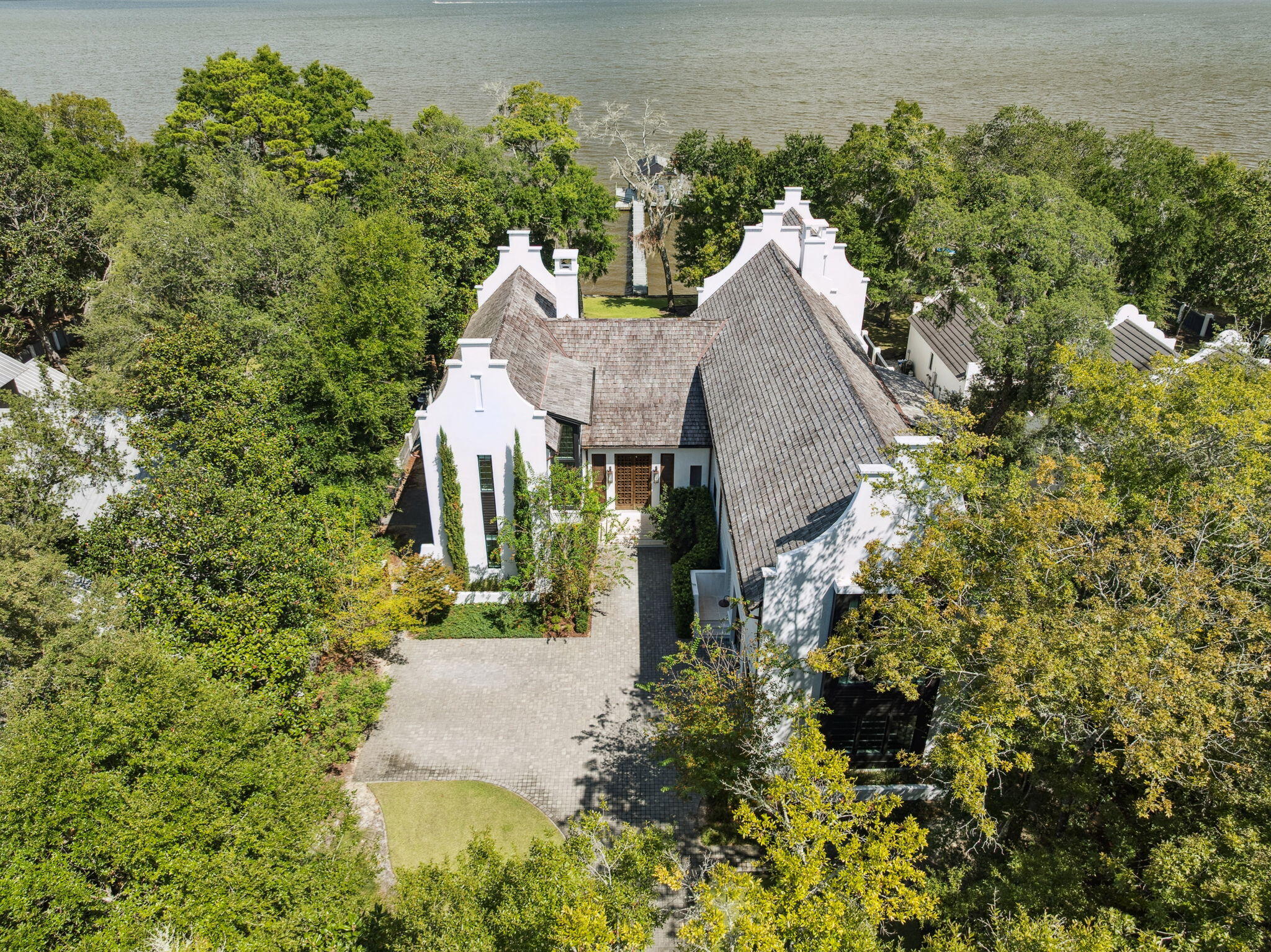 147 Ansley Forest Drive Santa Rosa Beach, FL 32459 - Photo 5 of 48 an aerial view of a house with a yard and large trees