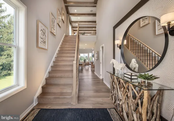 a view of staircase with wooden floor and a window