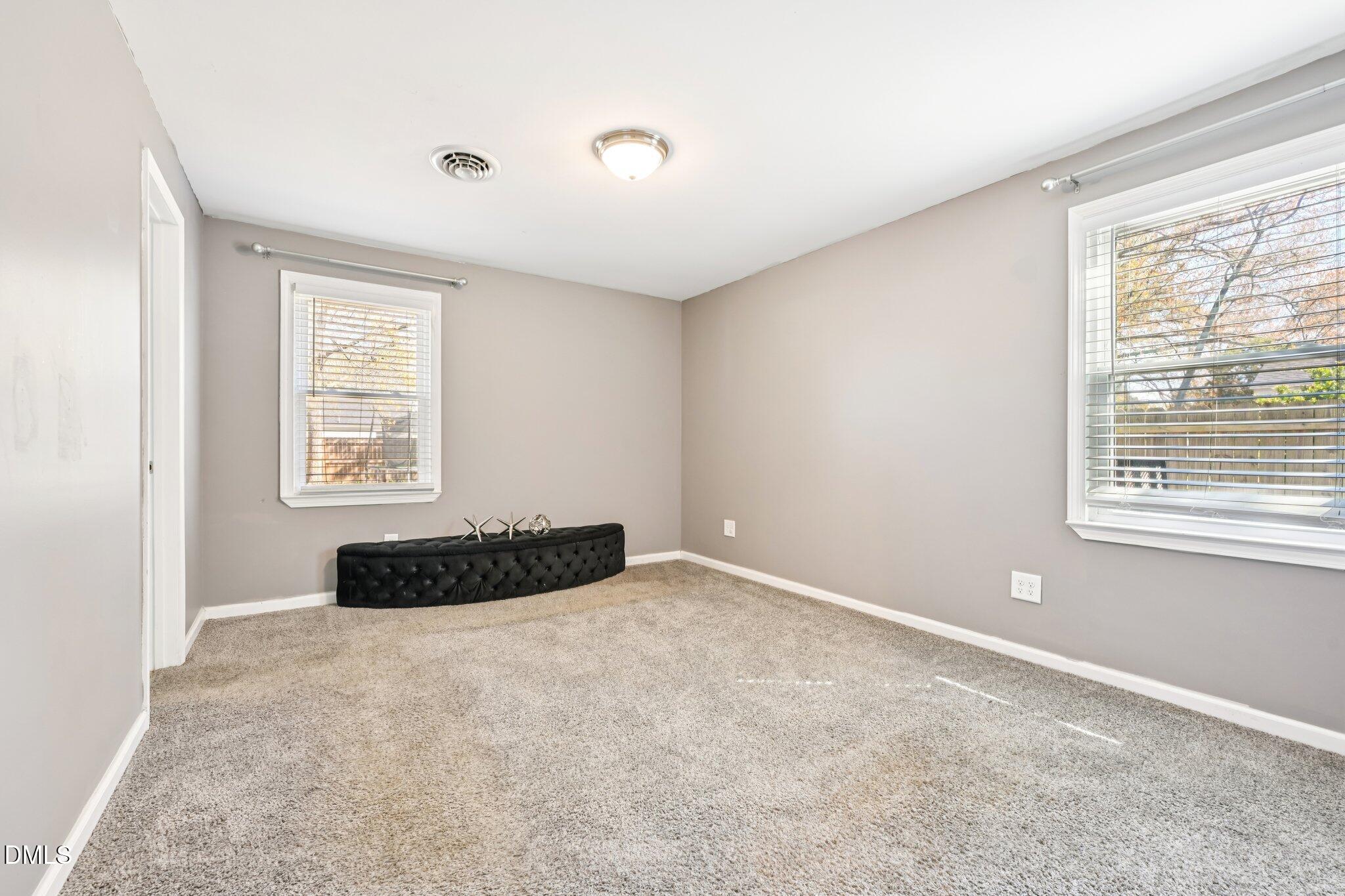 712 Fairground Road Dunn, NC 28334 - Photo 11 of 23 a bedroom with a bed and a window