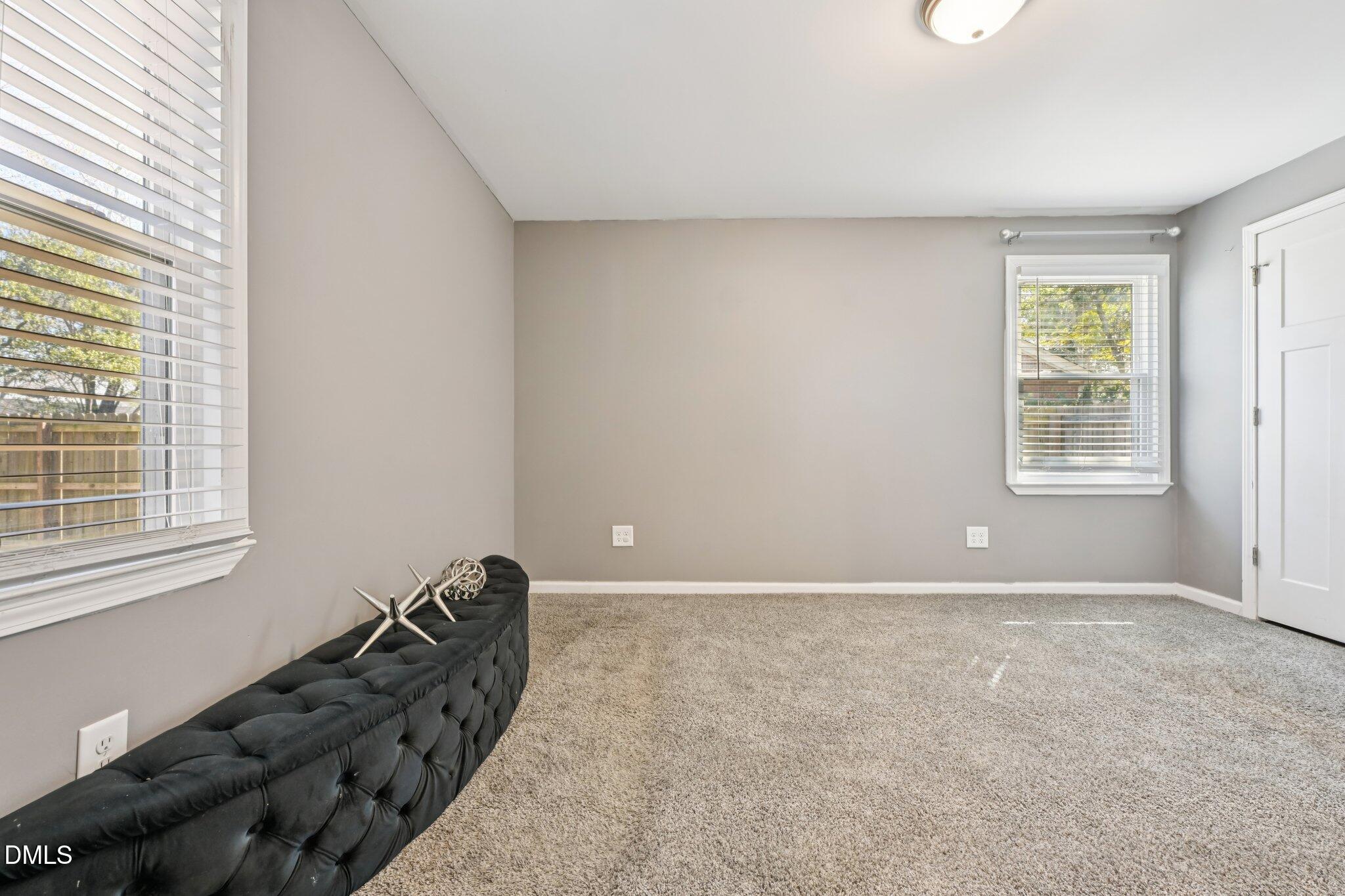 712 Fairground Road Dunn, NC 28334 - Photo 14 of 23 a view of an empty room with a window