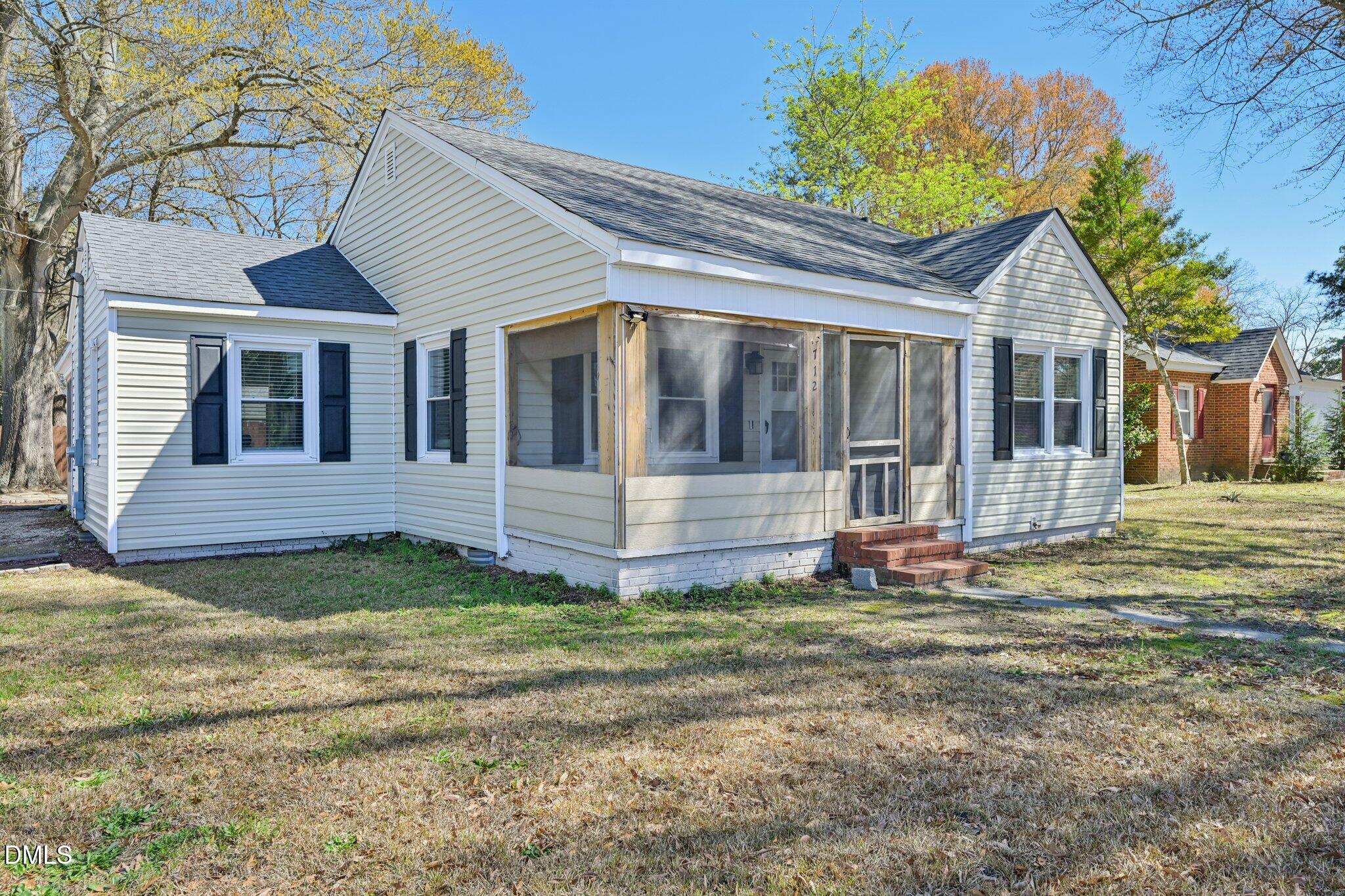 712 Fairground Road Dunn, NC 28334 - Photo 2 of 23 a view of a house with a yard