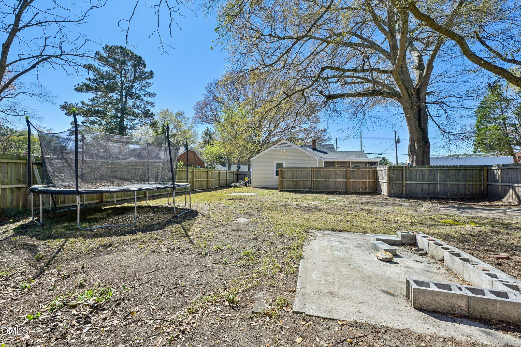 712 Fairground Road Dunn, NC 28334 - Photo 22 of 23 a view of a house with a yard