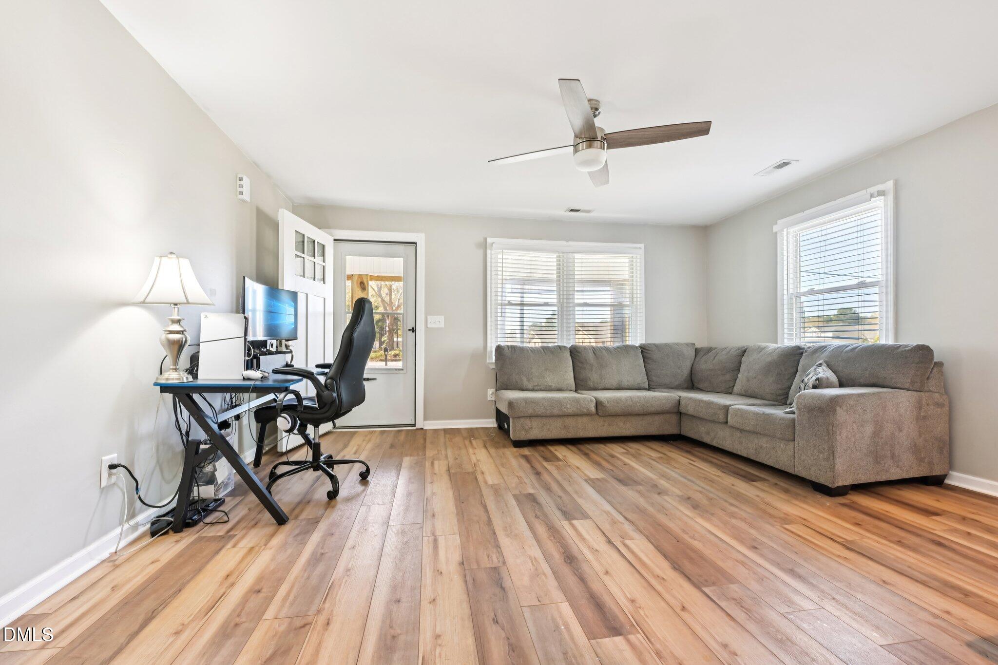 712 Fairground Road Dunn, NC 28334 - Photo 4 of 23 a living room with furniture and a wooden floor
