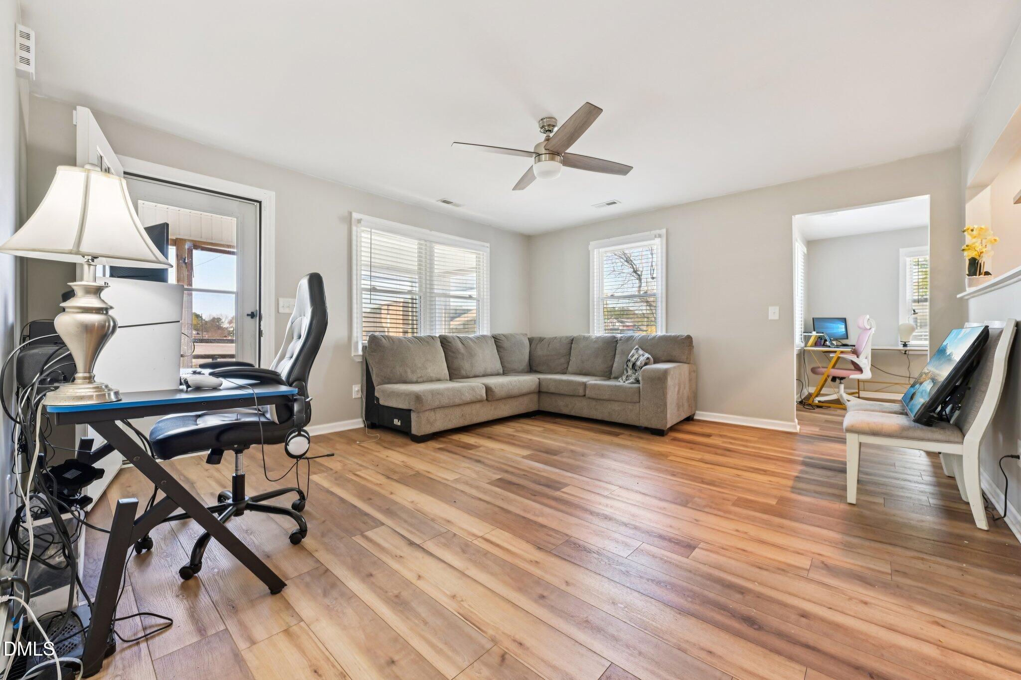 712 Fairground Road Dunn, NC 28334 - Photo 6 of 23 a living room with furniture and a wooden floor