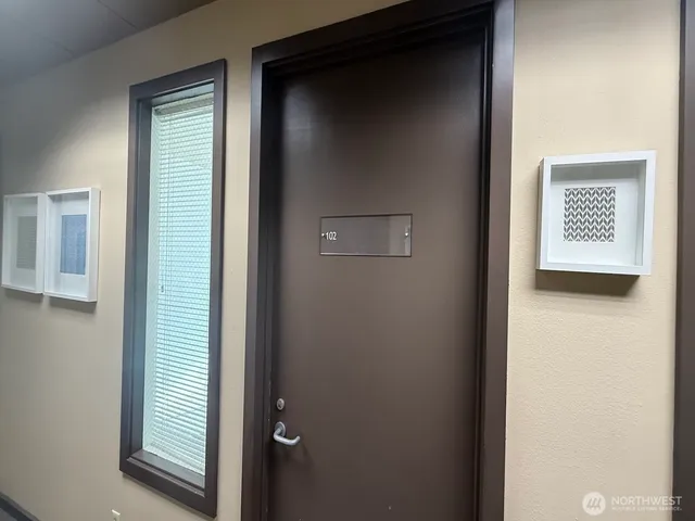 a view of an empty room with a window