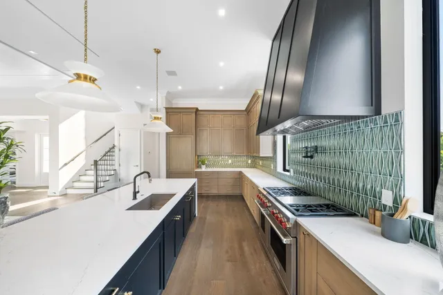 a spacious bedroom with a large bed and a potted plant