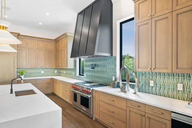 a large bathroom with a double vanity sink a toilet a mirror and shower