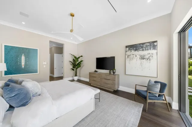 an aerial view of a house with a garden and lake view