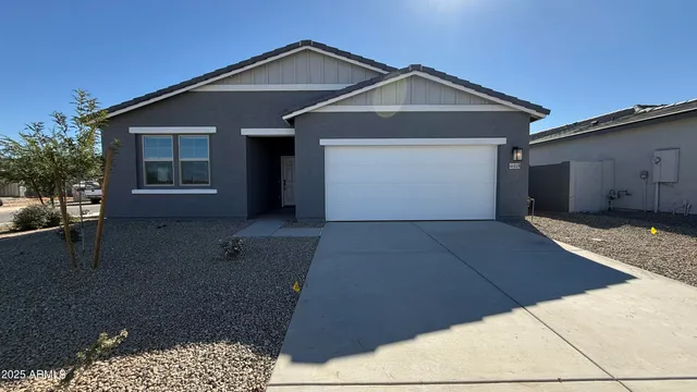 a front view of a house with a garage