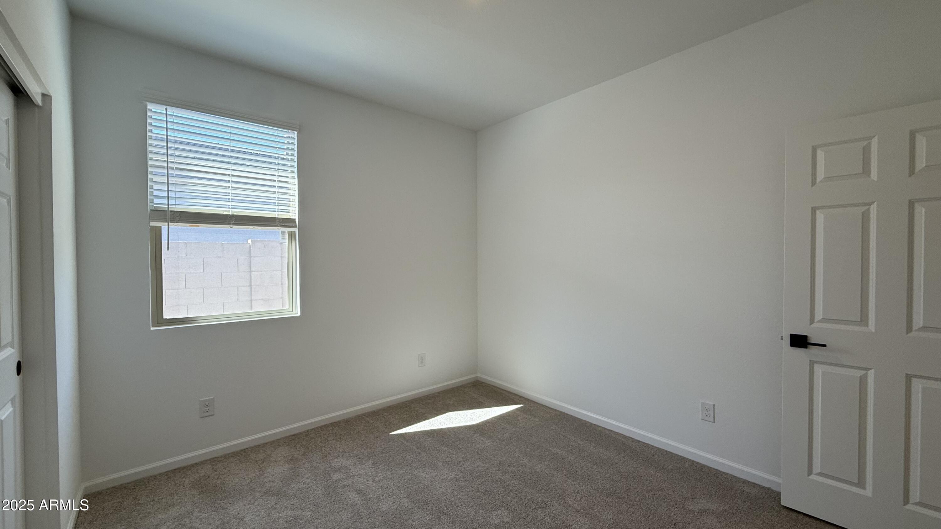 46819 West Old Timer Road Maricopa, AZ 85139 - Photo 27 of 44 an empty room with a window