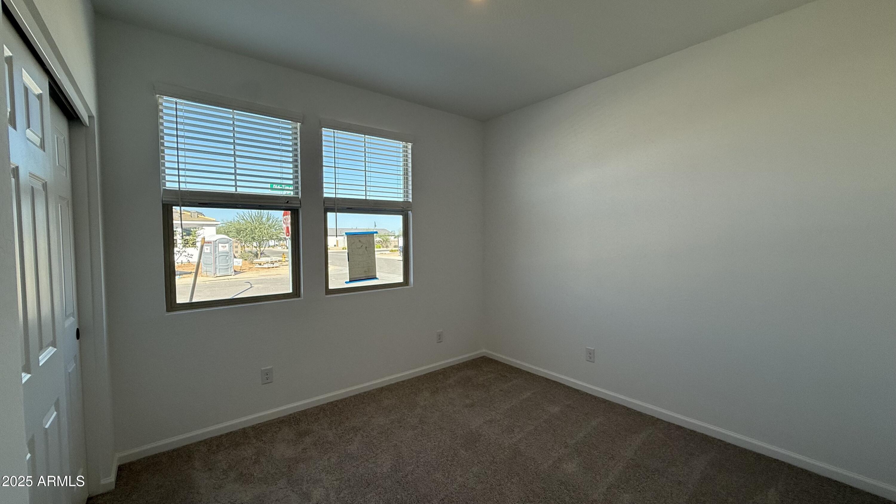 46819 West Old Timer Road Maricopa, AZ 85139 - Photo 6 of 44 an empty room with a window