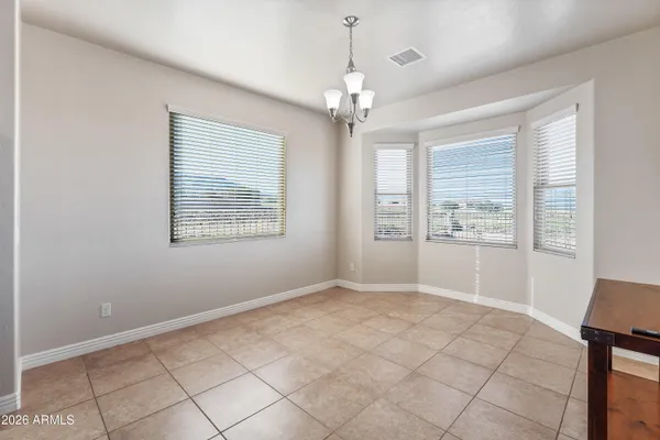a view of an empty room with windows