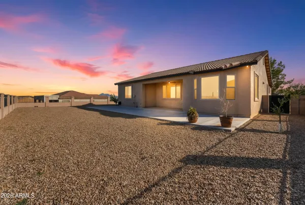 a view of a house with backyard and deck