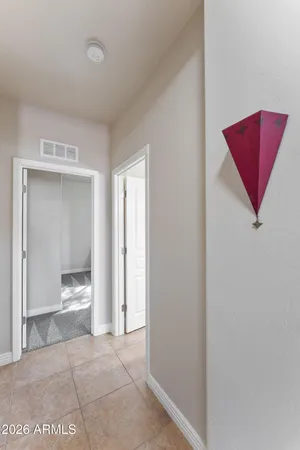 a view of an empty room and bathroom
