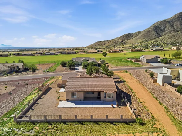 an aerial view of a house with a garden