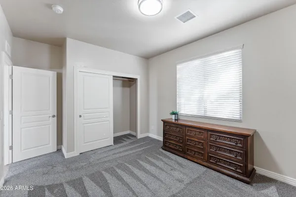 a room that has a bed and a window in it