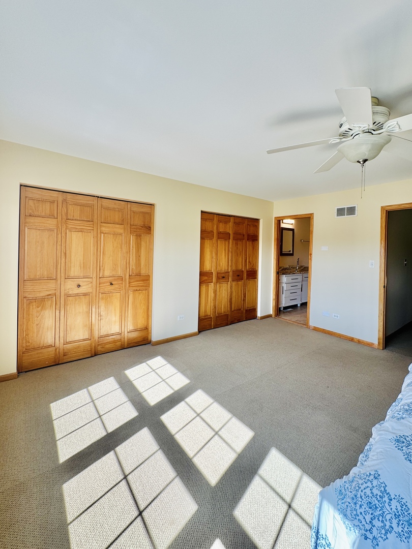 19245 Tramore Lane Mokena, IL 60448 - Photo 16 of 21 a view of empty room with windows