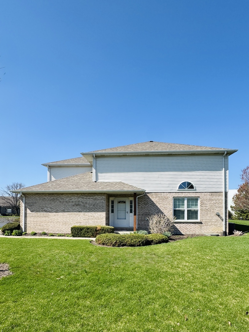 19245 Tramore Lane Mokena, IL 60448 - Photo 2 of 21 a front view of a house with a yard