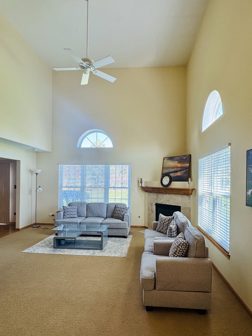 19245 Tramore Lane Mokena, IL 60448 - Photo 3 of 21 a living room with furniture and a chandelier