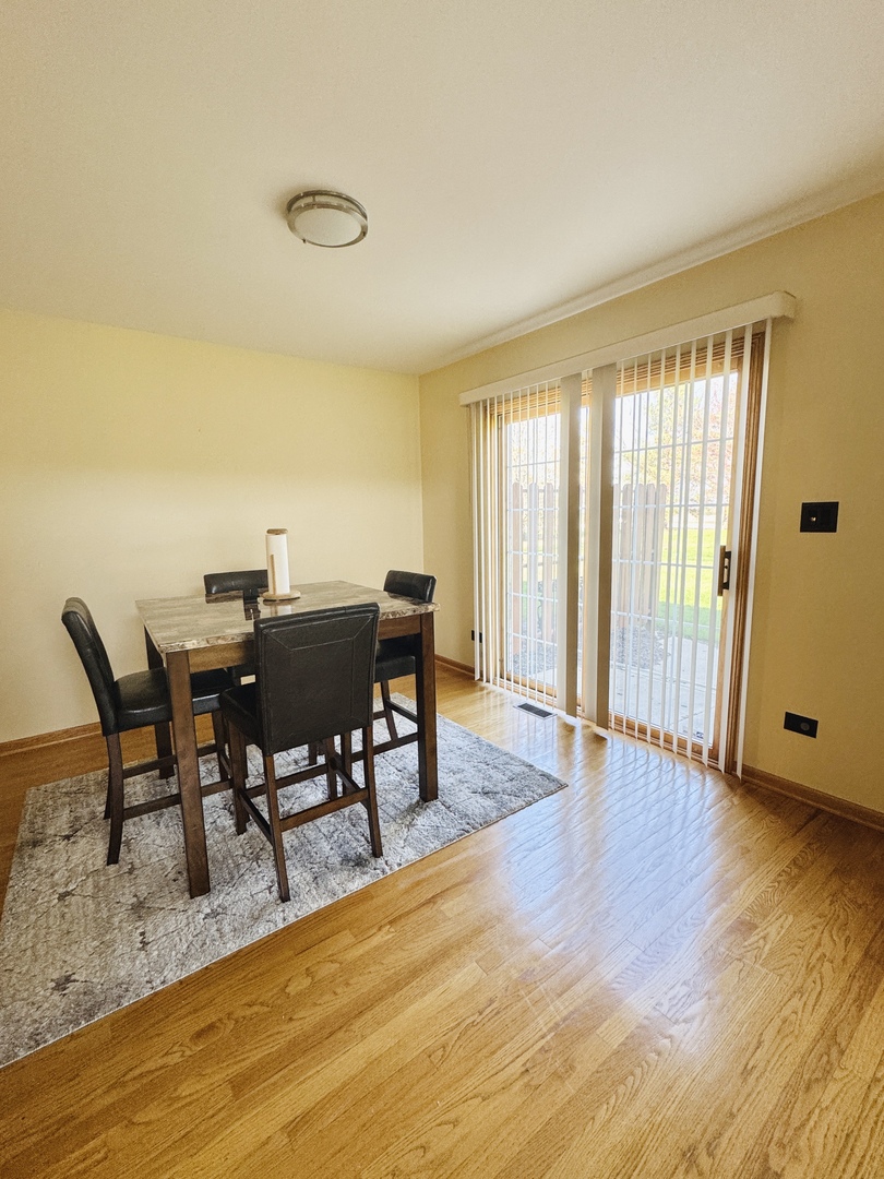 19245 Tramore Lane Mokena, IL 60448 - Photo 5 of 21 a view of a dining room with furniture and wooden floor