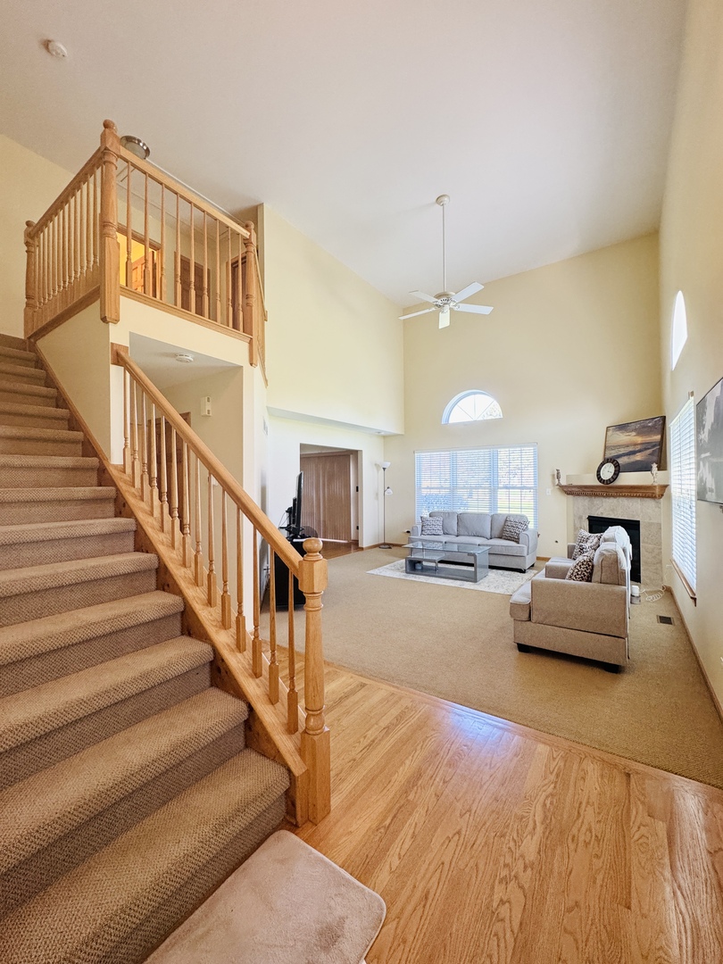 19245 Tramore Lane Mokena, IL 60448 - Photo 10 of 21 a living room with furniture and a chandelier