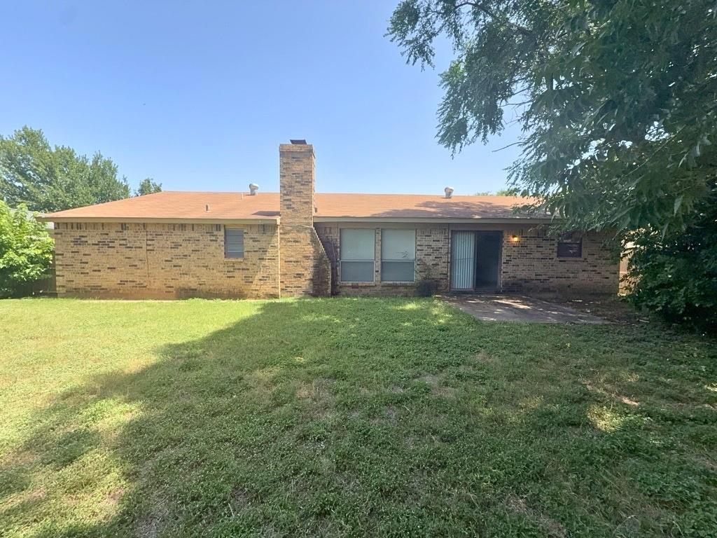 1613 Edgehill Road Benbrook, TX 76126 - Photo 21 of 22 a front view of a house with a yard