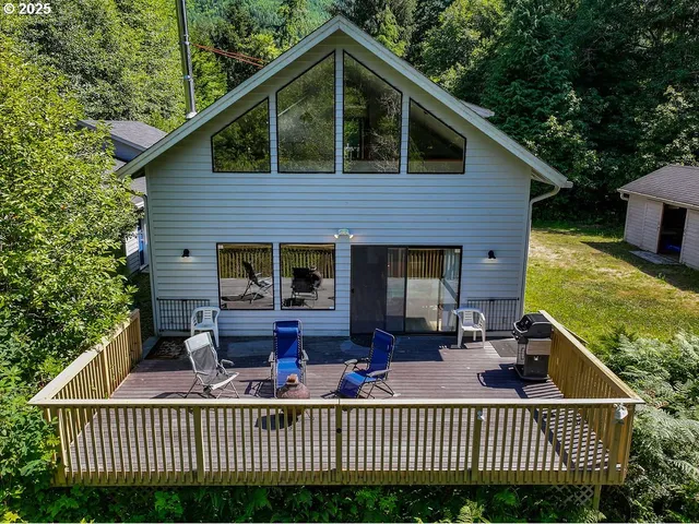 a view of a house with a deck and wooden floor