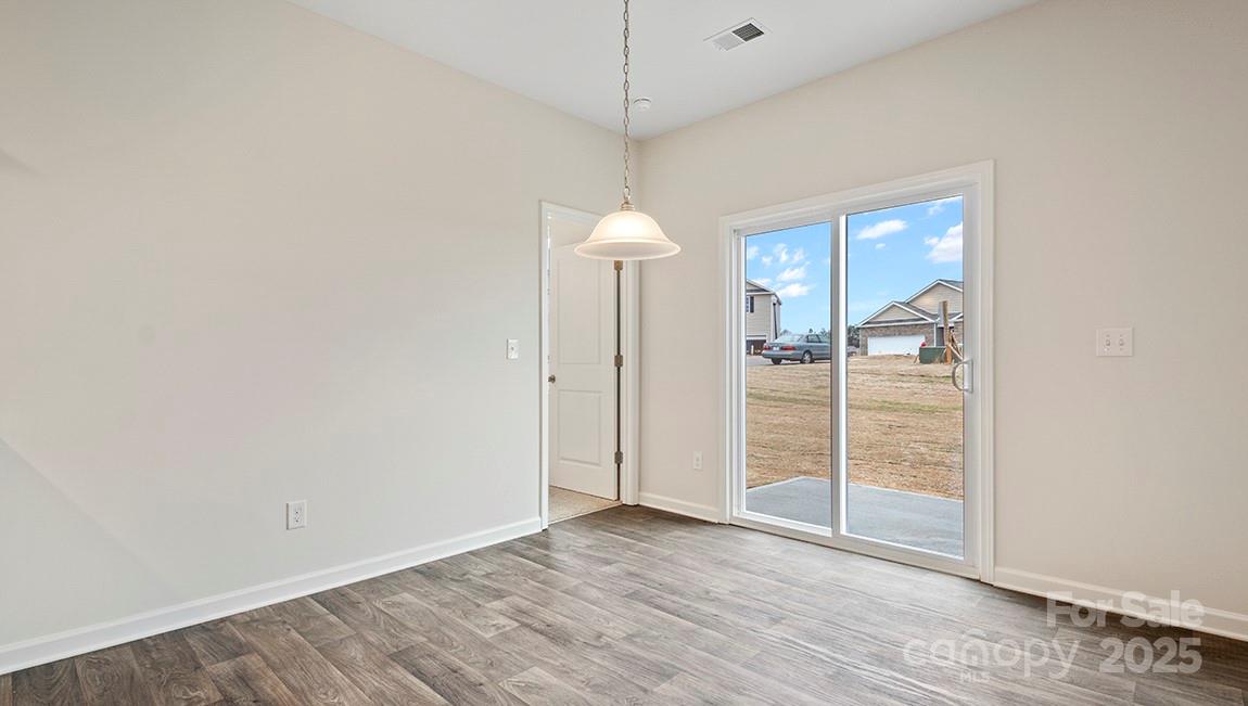 15 Shorthorn Road Fletcher, NC 28732 - Photo 15 of 34 a view of a room with wooden floor and white walls