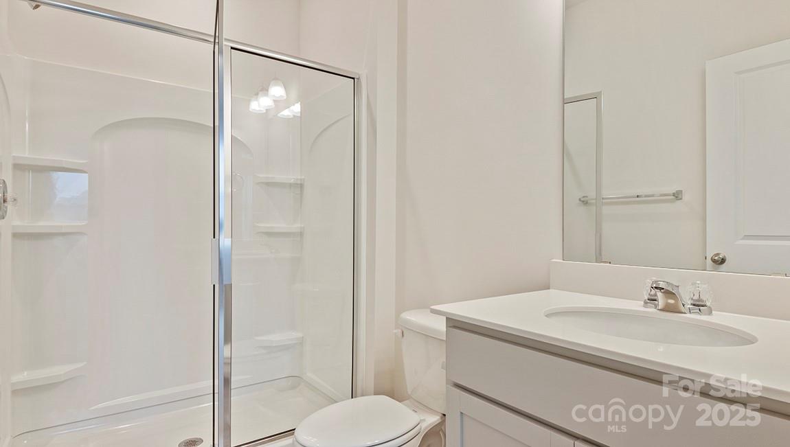 15 Shorthorn Road Fletcher, NC 28732 - Photo 25 of 34 a bathroom with a sink toilet and shower