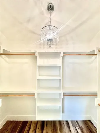 a bathroom with a double vanity sink mirror and toilet