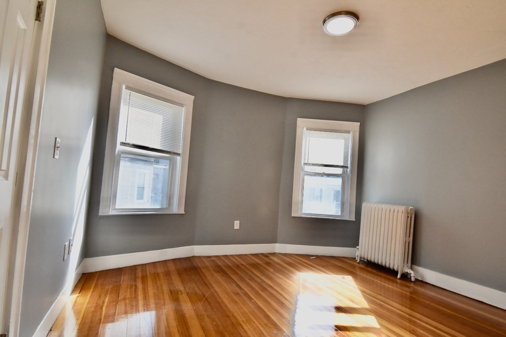 21 Treadway Road, Unit 2 Boston, MA 02125 - Photo 4 of 21 a view of a room that has a bed and a window