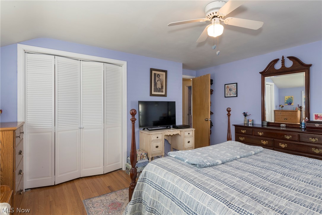 1170 Roland Road Lyndhurst, OH 44124 - Photo 19 of 36 Bedroom with light wood-type flooring, a closet, and ceiling fan