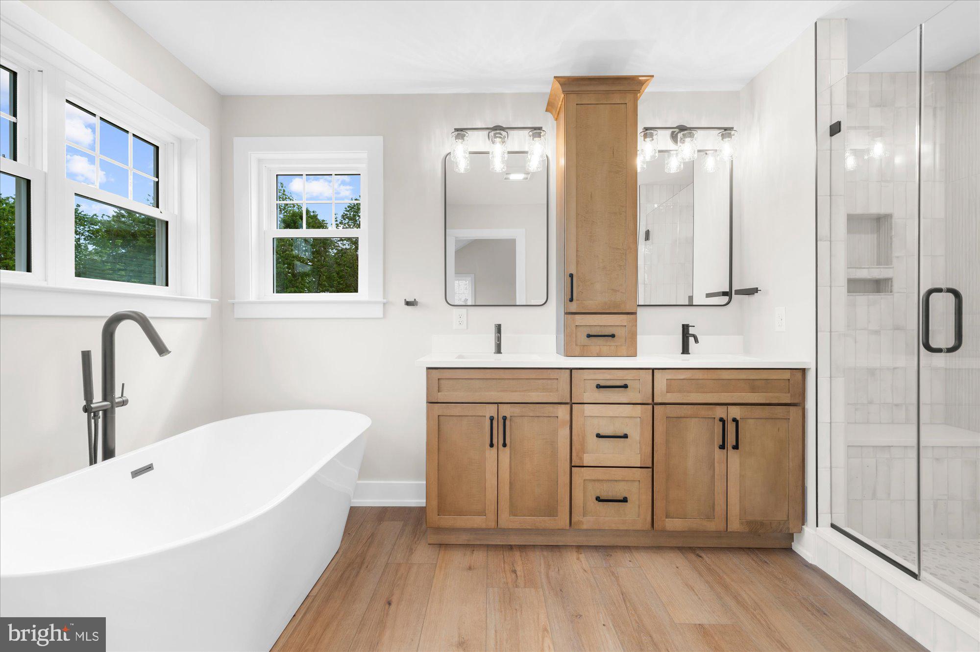 394 Renninger Road Perkiomenville, PA 18074 - Photo 26 of 41 a spacious bathroom with a double vanity sink a mirror and a bathtub
