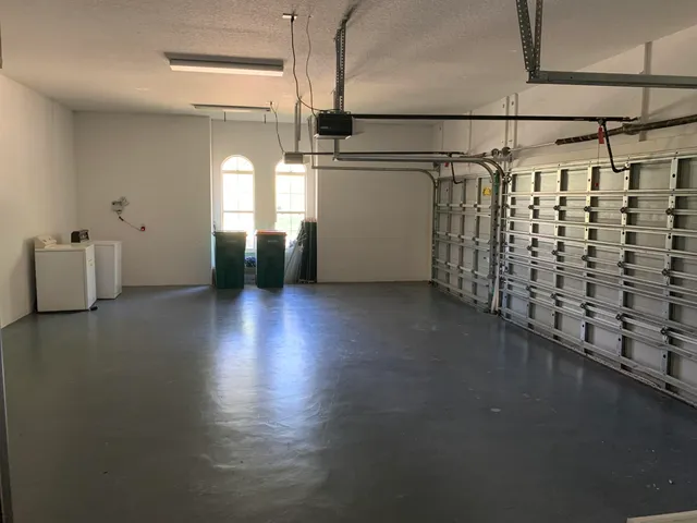 a view of hallway with stairs and wooden floor