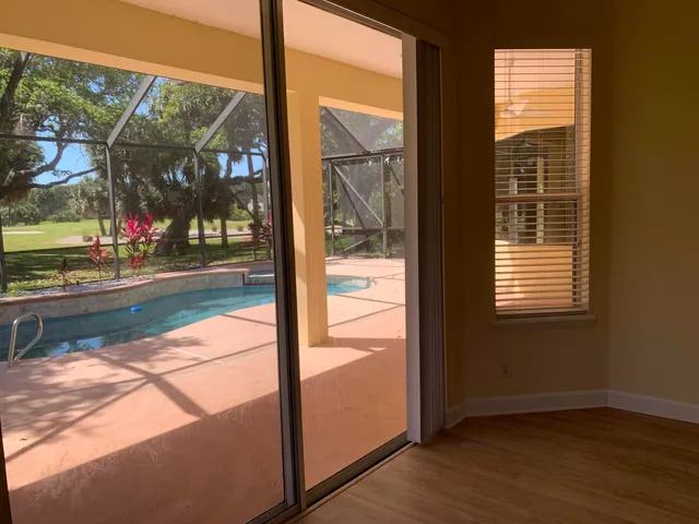 a view of swimming pool from a window