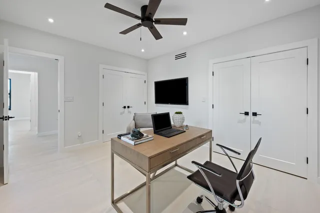 a view of a workspace with furniture