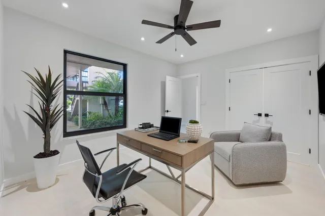 a work room with furniture and a window