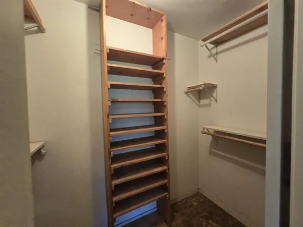 a bathroom with a toilet and a shower curtain